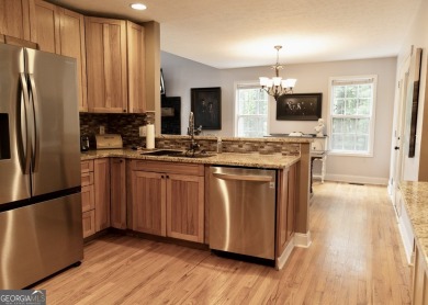 Step into this beautifully maintained home that welcomes you on Fairfield Plantation Golf and Country Club in Georgia - for sale on GolfHomes.com, golf home, golf lot