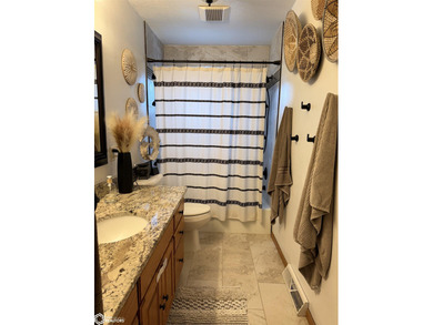 Welcome to this tastefully done 4 bedroom, 2 bath home situated on Carroll Municipal Golf Course in Iowa - for sale on GolfHomes.com, golf home, golf lot