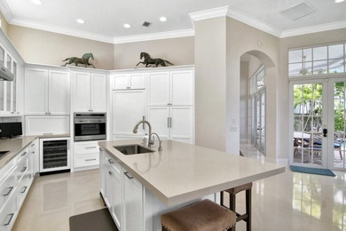 Discover timeless elegance in this 5-bedroom, 5.1/2 -bath on Palm Beach Polo and Country Club in Florida - for sale on GolfHomes.com, golf home, golf lot