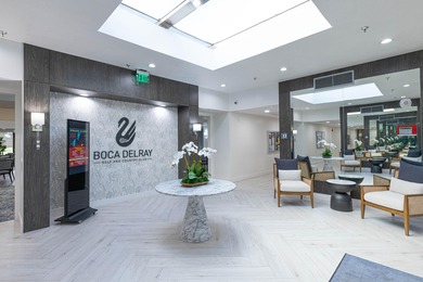 Enjoy serene views from this charming 1st floor 2BR/2BA + Den on Boca Delray Golf and Country Club in Florida - for sale on GolfHomes.com, golf home, golf lot