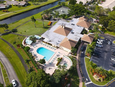 Enjoy serene views from this charming 1st floor 2BR/2BA + Den on Boca Delray Golf and Country Club in Florida - for sale on GolfHomes.com, golf home, golf lot