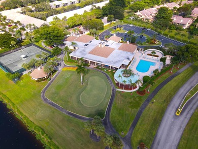 Enjoy serene views from this charming 1st floor 2BR/2BA + Den on Boca Delray Golf and Country Club in Florida - for sale on GolfHomes.com, golf home, golf lot