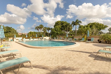 Enjoy serene views from this charming 1st floor 2BR/2BA + Den on Boca Delray Golf and Country Club in Florida - for sale on GolfHomes.com, golf home, golf lot