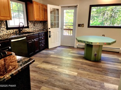 Entertainers delight inside and out with surprise lake view and on Lords Valley Country Club, Inc in Pennsylvania - for sale on GolfHomes.com, golf home, golf lot
