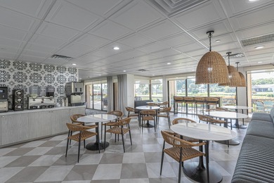 Enjoy serene views from this charming 1st floor 2BR/2BA + Den on Boca Delray Golf and Country Club in Florida - for sale on GolfHomes.com, golf home, golf lot