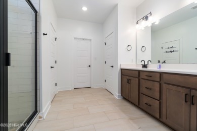 This beautifully crafted home combines refined finishes with on Minnesott Golf and Country Club in North Carolina - for sale on GolfHomes.com, golf home, golf lot