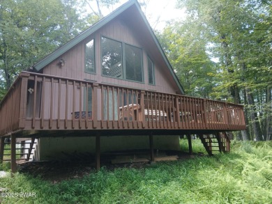 Escape to this delightful 3-bedroom, 1-bath chalet in the heart on The Hideout Golf in Pennsylvania - for sale on GolfHomes.com, golf home, golf lot
