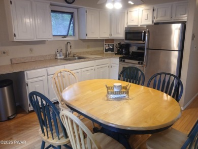 Escape to this delightful 3-bedroom, 1-bath chalet in the heart on The Hideout Golf in Pennsylvania - for sale on GolfHomes.com, golf home, golf lot