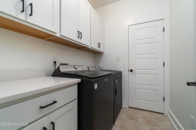 This beautifully crafted home combines refined finishes with on Minnesott Golf and Country Club in North Carolina - for sale on GolfHomes.com, golf home, golf lot