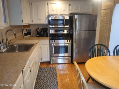 Escape to this delightful 3-bedroom, 1-bath chalet in the heart on The Hideout Golf in Pennsylvania - for sale on GolfHomes.com, golf home, golf lot