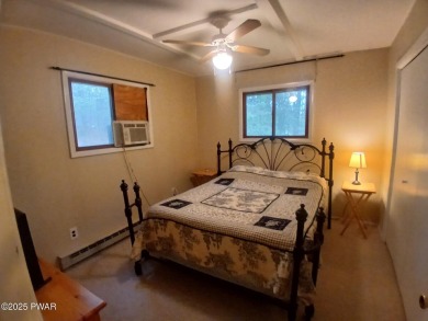 Escape to this delightful 3-bedroom, 1-bath chalet in the heart on The Hideout Golf in Pennsylvania - for sale on GolfHomes.com, golf home, golf lot