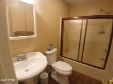 Escape to this delightful 3-bedroom, 1-bath chalet in the heart on The Hideout Golf in Pennsylvania - for sale on GolfHomes.com, golf home, golf lot