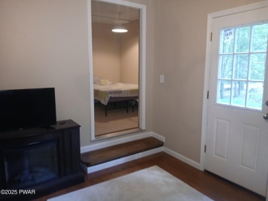 Escape to this delightful 3-bedroom, 1-bath chalet in the heart on The Hideout Golf in Pennsylvania - for sale on GolfHomes.com, golf home, golf lot