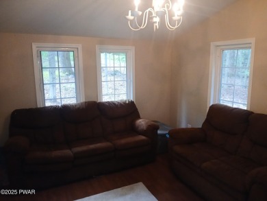 Escape to this delightful 3-bedroom, 1-bath chalet in the heart on The Hideout Golf in Pennsylvania - for sale on GolfHomes.com, golf home, golf lot
