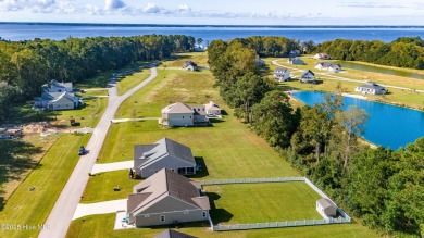 This beautifully crafted home combines refined finishes with on Minnesott Golf and Country Club in North Carolina - for sale on GolfHomes.com, golf home, golf lot