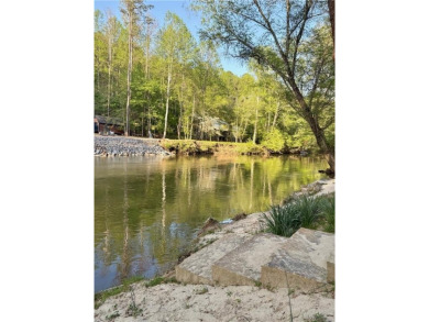 Riverfront living at it's finest with 110 feet of river frontage on White Path Golf Club in Georgia - for sale on GolfHomes.com, golf home, golf lot