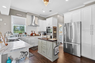Experience Resort-style Living In This Beautifully Furnished on Marsh Creek Country Club in Florida - for sale on GolfHomes.com, golf home, golf lot