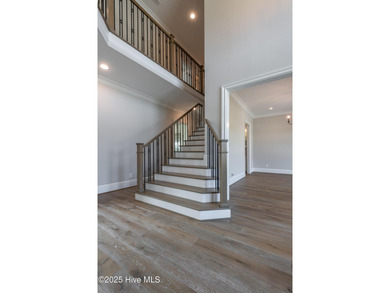 There is also a bonus room ideal for a home theater, playroom on Ironwood Golf and Country Club in North Carolina - for sale on GolfHomes.com, golf home, golf lot