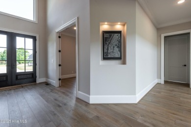 Luxury, craftsmanship, and privacy converge at 541 White Horse on Ironwood Golf and Country Club in North Carolina - for sale on GolfHomes.com, golf home, golf lot