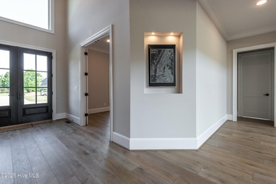 There is also a bonus room ideal for a home theater, playroom on Ironwood Golf and Country Club in North Carolina - for sale on GolfHomes.com, golf home, golf lot