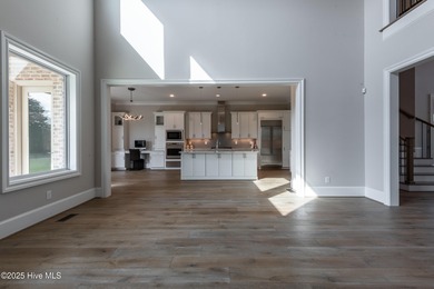 There is also a bonus room ideal for a home theater, playroom on Ironwood Golf and Country Club in North Carolina - for sale on GolfHomes.com, golf home, golf lot