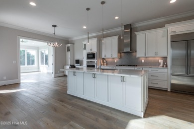 There is also a bonus room ideal for a home theater, playroom on Ironwood Golf and Country Club in North Carolina - for sale on GolfHomes.com, golf home, golf lot