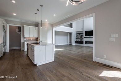 There is also a bonus room ideal for a home theater, playroom on Ironwood Golf and Country Club in North Carolina - for sale on GolfHomes.com, golf home, golf lot