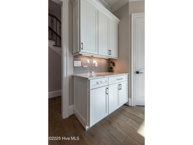 There is also a bonus room ideal for a home theater, playroom on Ironwood Golf and Country Club in North Carolina - for sale on GolfHomes.com, golf home, golf lot