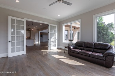 There is also a bonus room ideal for a home theater, playroom on Ironwood Golf and Country Club in North Carolina - for sale on GolfHomes.com, golf home, golf lot