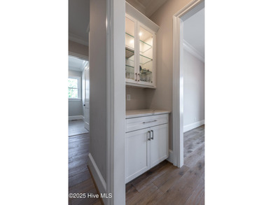 There is also a bonus room ideal for a home theater, playroom on Ironwood Golf and Country Club in North Carolina - for sale on GolfHomes.com, golf home, golf lot