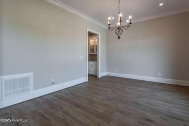 There is also a bonus room ideal for a home theater, playroom on Ironwood Golf and Country Club in North Carolina - for sale on GolfHomes.com, golf home, golf lot