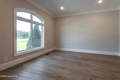 There is also a bonus room ideal for a home theater, playroom on Ironwood Golf and Country Club in North Carolina - for sale on GolfHomes.com, golf home, golf lot