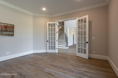 There is also a bonus room ideal for a home theater, playroom on Ironwood Golf and Country Club in North Carolina - for sale on GolfHomes.com, golf home, golf lot