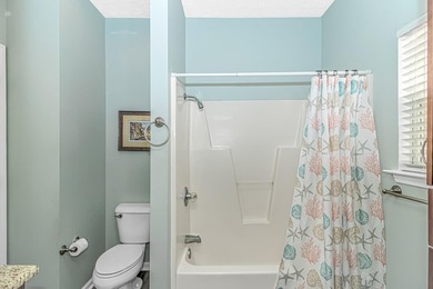 This spacious 4 LARGE Bedroom 4 Bath raised beach house is just on Prestwick Country Club in South Carolina - for sale on GolfHomes.com, golf home, golf lot