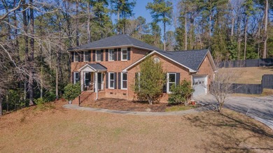 Nestled in the desirable Houndslake neighborhood, this inviting on Houndslake Country Club in South Carolina - for sale on GolfHomes.com, golf home, golf lot