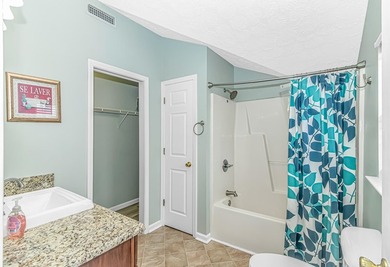 This spacious 4 LARGE Bedroom 4 Bath raised beach house is just on Prestwick Country Club in South Carolina - for sale on GolfHomes.com, golf home, golf lot