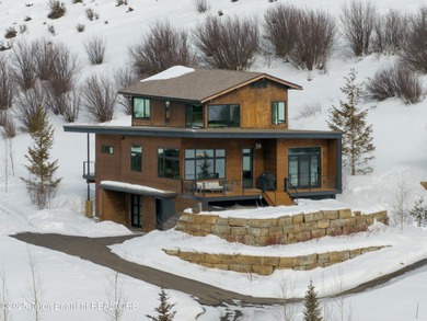 Indulge in the ultimate mountain retreat with this fully on Snake River Sporting Club in Wyoming - for sale on GolfHomes.com, golf home, golf lot