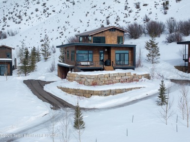 Indulge in the ultimate mountain retreat with this fully on Snake River Sporting Club in Wyoming - for sale on GolfHomes.com, golf home, golf lot