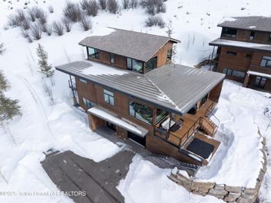 Indulge in the ultimate mountain retreat with this fully on Snake River Sporting Club in Wyoming - for sale on GolfHomes.com, golf home, golf lot