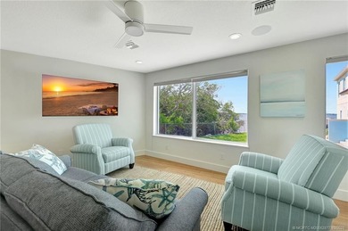 This stunning two-story custom-built home offers breathtaking on Island Dunes Country Club in Florida - for sale on GolfHomes.com, golf home, golf lot