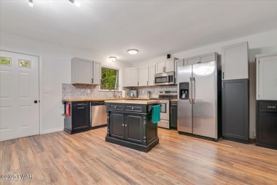 Fully remodeled 4-Bedroom Home in Tanglwood Lakes with Lake on Paupack Hills Golf and Country Club in Pennsylvania - for sale on GolfHomes.com, golf home, golf lot