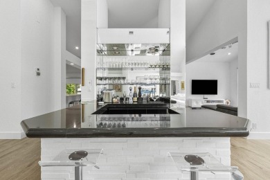 Step into modern elegance and timeless comfort with this on Bocaire Country Club in Florida - for sale on GolfHomes.com, golf home, golf lot