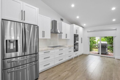 Step into modern elegance and timeless comfort with this on Bocaire Country Club in Florida - for sale on GolfHomes.com, golf home, golf lot