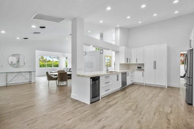 Step into modern elegance and timeless comfort with this on Bocaire Country Club in Florida - for sale on GolfHomes.com, golf home, golf lot