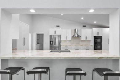 Step into modern elegance and timeless comfort with this on Bocaire Country Club in Florida - for sale on GolfHomes.com, golf home, golf lot