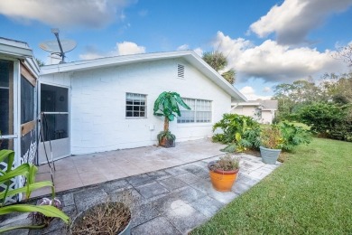 Discover the perfect blend of comfort, space, and location in on Palm Harbor Golf Club in Florida - for sale on GolfHomes.com, golf home, golf lot