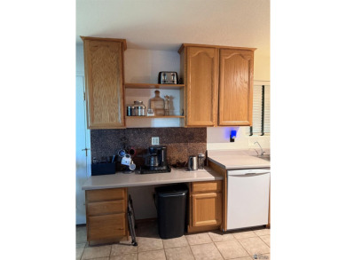 Enjoy this two-bedroom home with a detached two- car garage that on The Links At Coyote Wash in Arizona - for sale on GolfHomes.com, golf home, golf lot