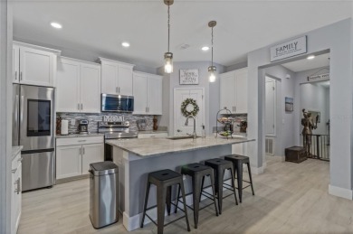 FULL GOLF & TENNIS MEMBERSHP INCLUDED.  Step into luxury living on The Oasis Club at Champions Gate in Florida - for sale on GolfHomes.com, golf home, golf lot