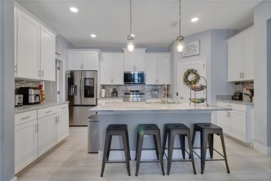 FULL GOLF & TENNIS MEMBERSHP INCLUDED.  Step into luxury living on The Oasis Club at Champions Gate in Florida - for sale on GolfHomes.com, golf home, golf lot