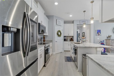 FULL GOLF & TENNIS MEMBERSHP INCLUDED.  Step into luxury living on The Oasis Club at Champions Gate in Florida - for sale on GolfHomes.com, golf home, golf lot